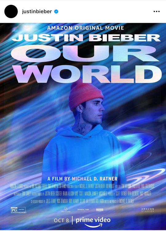 Justin Bieber Our World movie cover wearing hoodie with gold eyelets by Les Tien