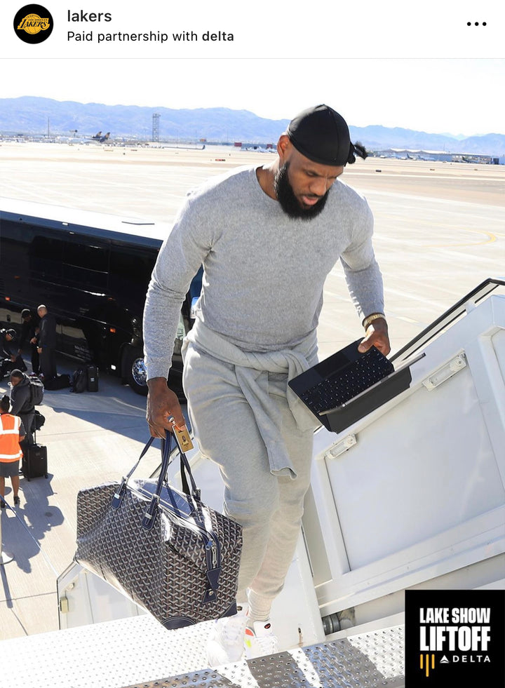 Lebron James on Lakers instagram post wearing grey sweatsuit.