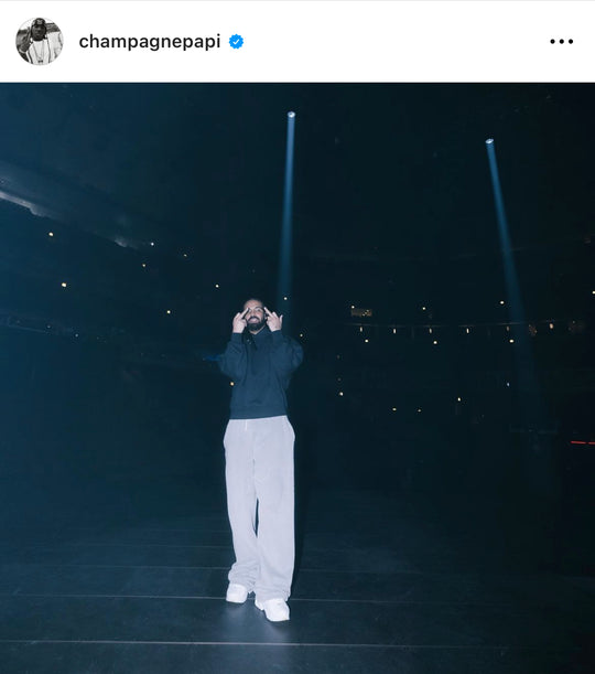 Drake IG post wearing hoodie with gold eyelets