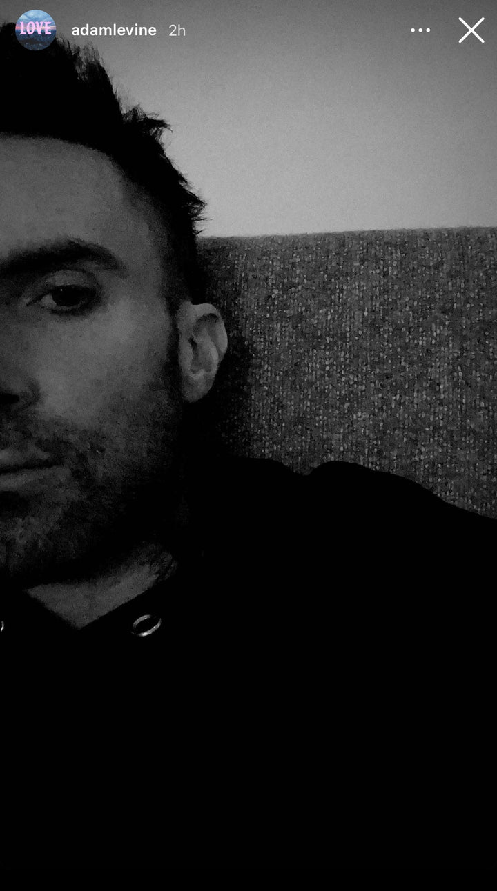 Adam Levine wearing Les Tien sweatshirt with gold eyelets showing